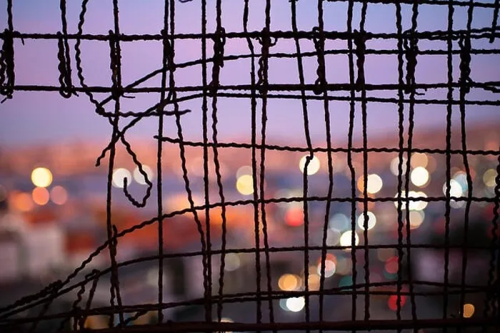 Framed Print : Blurry close up of Valparaiso during dusk through a wire fence Framed Print : Blurry close up of Valparaiso during dusk through a wire fence