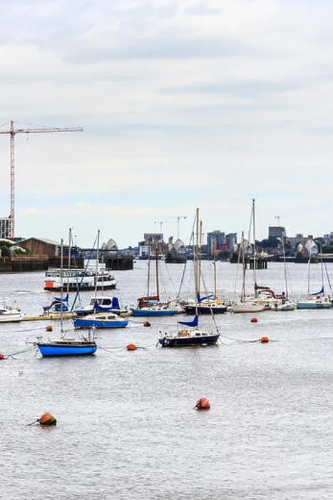 Framed Print : Boats on the he River Thames, looking downriver towards the Thames Barrier, North Greenwich, London, UK Framed Print : Boats on the he River Thames, looking downriver towards the Thames Barrier, North Greenwich, London, UK