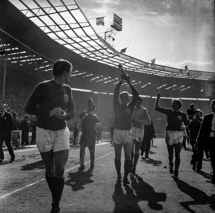 Framed Print : Bobby Moore lifts the Jules Rimet trophy aloft during a lap of honour in Wembley Stadium as the England football team Framed Print : Bobby Moore lifts the Jules Rimet trophy aloft during a lap of honour in Wembley Stadium as the England football team