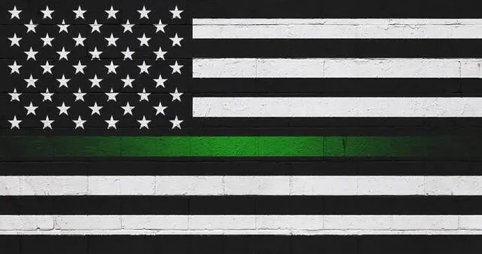 Framed Print : Border patrol thin green line flag painted on a cinder block wall Framed Print : Border patrol thin green line flag painted on a cinder block wall
