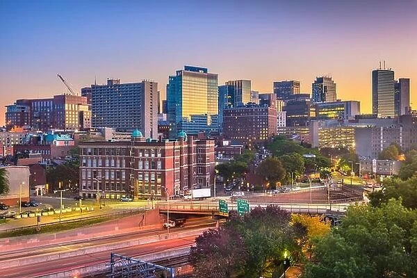 Boston, Massachusetts, USA cityscape over highways at dawn