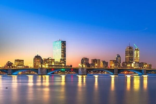 Boston, Massachusetts, USA downtown cityscape from across the Charles River at dawn