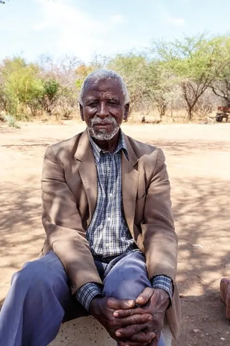 Framed Print : BOTSWANA, FRANCISTOWN, OCTOBER 28: old African man, sits by road to Francistown, the second largest city in Botswana, October 28, 2014, Botswana Framed Print : BOTSWANA, FRANCISTOWN, OCTOBER 28: old African man, sits by road to Francistown, the second largest city in Botswana, October 28, 2014, Botswana