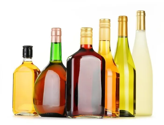 Framed Print : Bottles of assorted alcoholic beverages isolated on white background Framed Print : Bottles of assorted alcoholic beverages isolated on white background