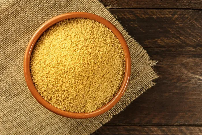 Framed Print : A bowl of raw couscous, shot from above on dark rustic textures with a place for text Framed Print : A bowl of raw couscous, shot from above on dark rustic textures with a place for text