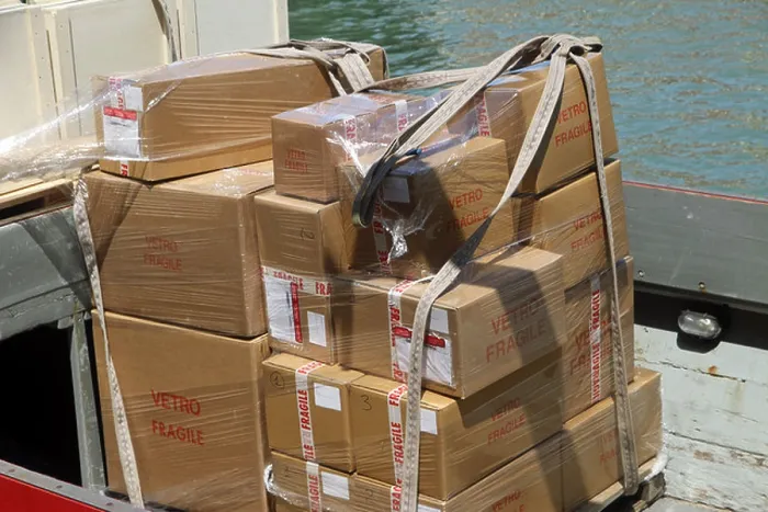 Framed Print : boxes for transporting precious Murano glass chandeliers made in Italy and loaded on to a boat Framed Print : boxes for transporting precious Murano glass chandeliers made in Italy and loaded on to a boat