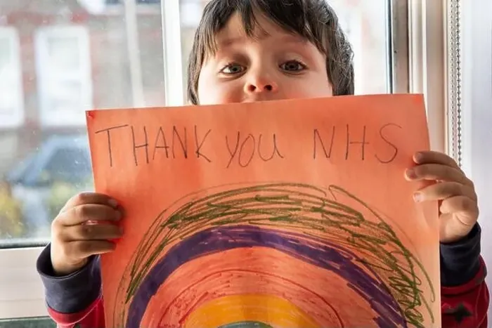 Framed Print : A boy holding up a drawing of a rainbow with the words Thank You NHS Framed Print : A boy holding up a drawing of a rainbow with the words Thank You NHS