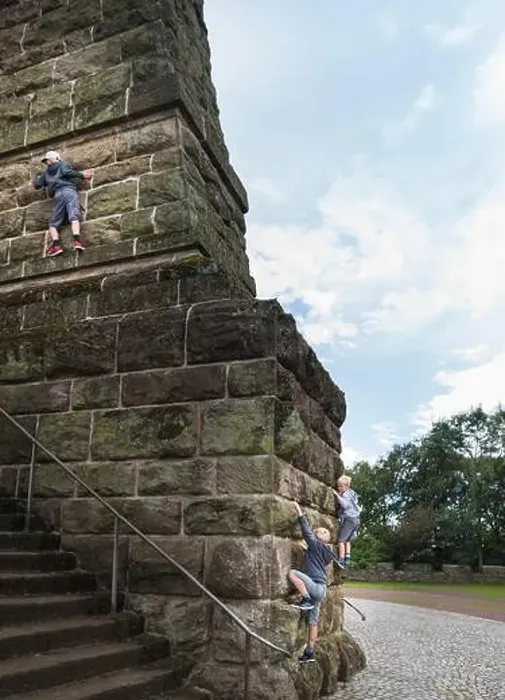Framed Print : Boys climbing stone wall Framed Print : Boys climbing stone wall