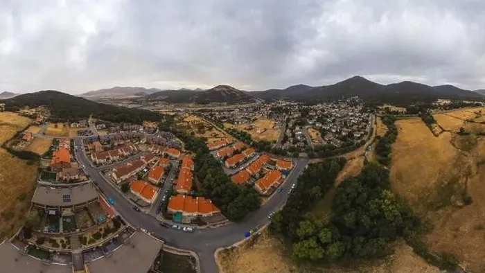 Framed Print : Breathtaking drone view of houses with red roof on Segovia city located in valley near mountains Framed Print : Breathtaking drone view of houses with red roof on Segovia city located in valley near mountains