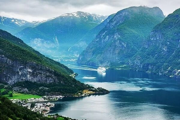 Breathtaking view of Sunnylvsfjorden fjord and cruise ship, near Geiranger village in western Norway. Landscape photography