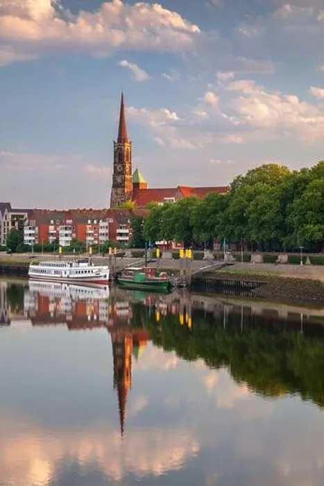 Framed Print : Bremen, Germany. Cityscape image of riverside Bremen, Germany with reflection of the St. Stephani Church in Weser River at summer sunrise Framed Print : Bremen, Germany. Cityscape image of riverside Bremen, Germany with reflection of the St. Stephani Church in Weser River at summer sunrise