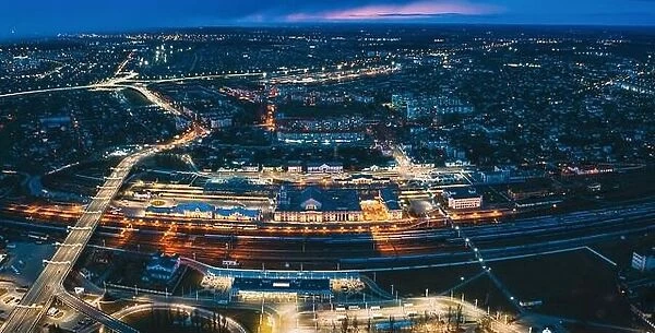 Brest, Belarus. Aerial Bird's-eye View Of Cityscape Skyline. Night Traffic In Residential District. Night Aerial View Of Railway Station. Panorama
