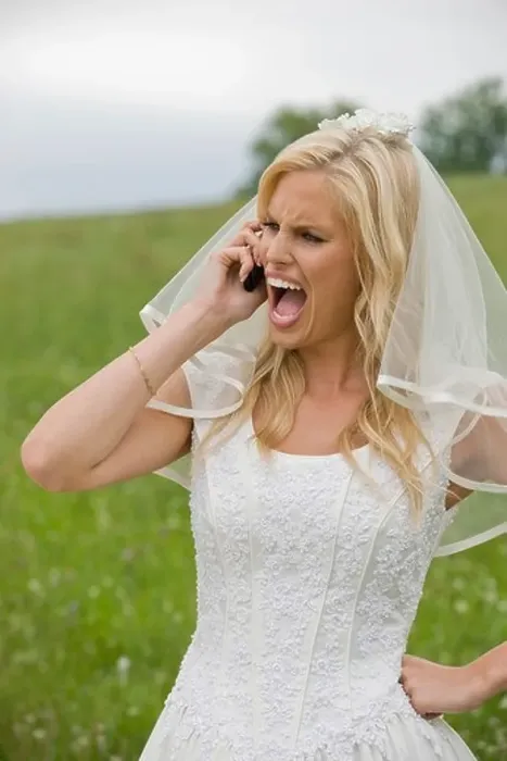 Framed Print : Bride shouting on the phone, hand on hip Framed Print : Bride shouting on the phone, hand on hip