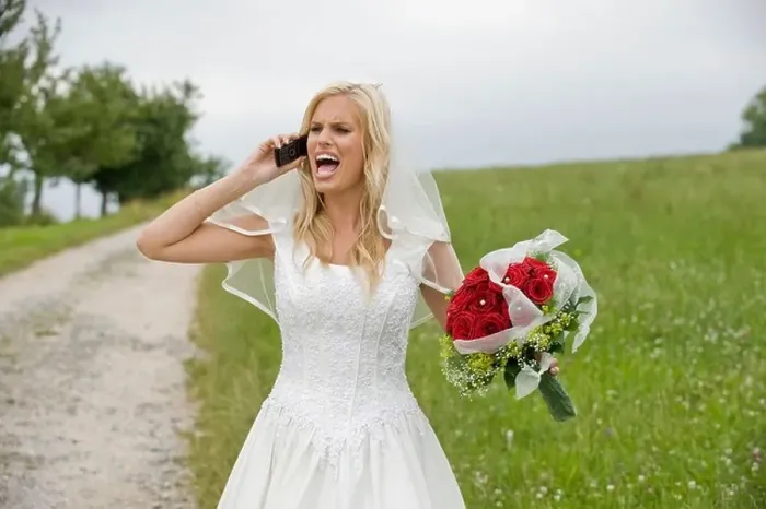 Framed Print : Bride shouting on the phone, holding bouquet Framed Print : Bride shouting on the phone, holding bouquet