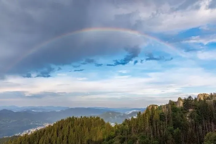 Framed Print : Bright multicolored natural rainbow with different colors on a light daytime cloudy sky Framed Print : Bright multicolored natural rainbow with different colors on a light daytime cloudy sky