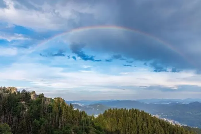 Framed Print : Bright multicolored natural rainbow with different colors on a light daytime cloudy sky Framed Print : Bright multicolored natural rainbow with different colors on a light daytime cloudy sky