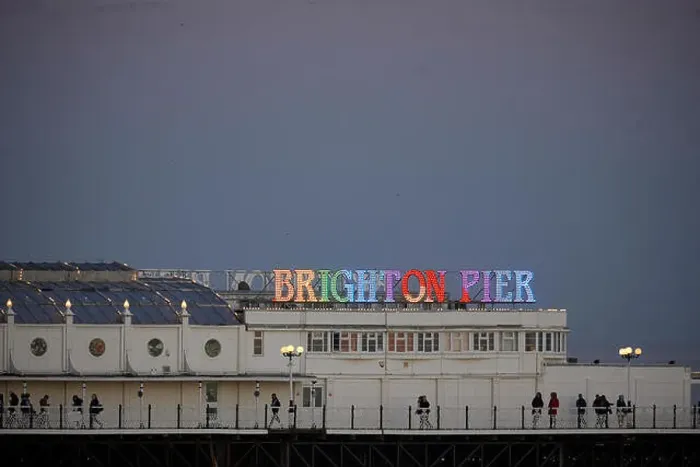 Framed Print : Brighton Pier lit like a rainbow at night in England Framed Print : Brighton Pier lit like a rainbow at night in England