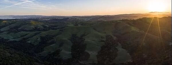A brilliant sunrise greets the hills of the East Bay, not far from San Francisco Bay in California