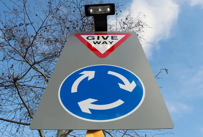 Framed Print : british road sign indicating a roundabout ahead and instructing road users to give way on reaching it Framed Print : british road sign indicating a roundabout ahead and instructing road users to give way on reaching it