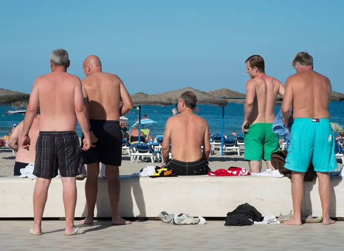 Framed Print : British tourists on the beach in Javea, Spain Framed Print : British tourists on the beach in Javea, Spain