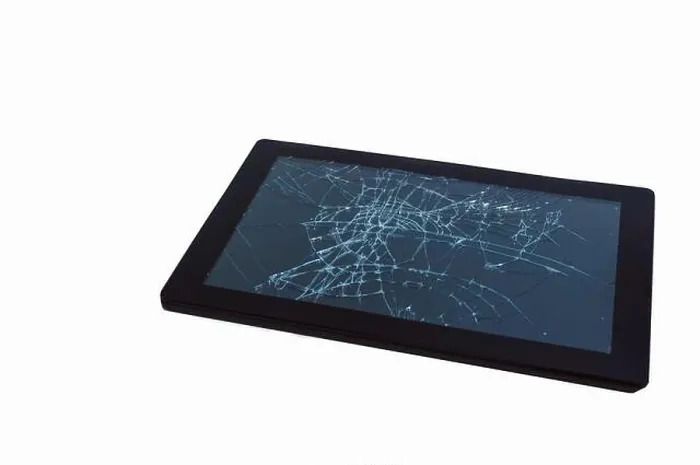 Framed Print : A broken tablet computer as detailed close-up shot on neutral white background Framed Print : A broken tablet computer as detailed close-up shot on neutral white background