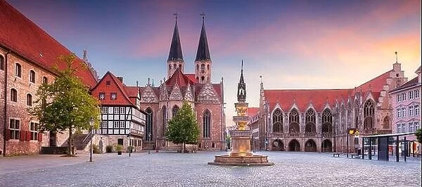 Brunswick, Germany. Panoramic cityscape image of historical downtown of Brunswick, Germany with St. Martini Church and Old Town Hall at summer sunset