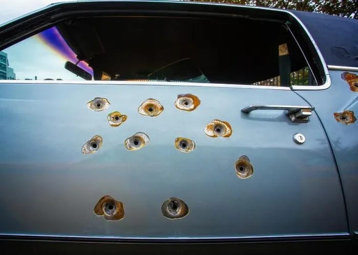 Framed Print : Bullet holes in a Cadillac Car Door Framed Print : Bullet holes in a Cadillac Car Door