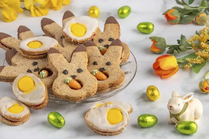 Framed Print : Bunny biscuits and egg biscuits decorated with icing next to Easter eggs and spring flowers Framed Print : Bunny biscuits and egg biscuits decorated with icing next to Easter eggs and spring flowers