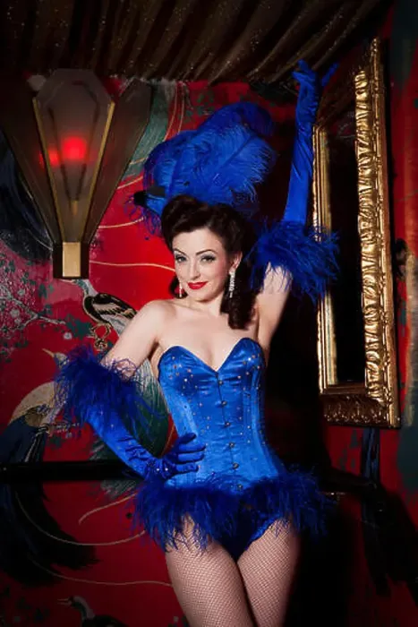 Framed Print : Burlesque performer Polly Rae at Madame Jojos, wearing blue feather head dress and blue corset, London Framed Print : Burlesque performer Polly Rae at Madame Jojos, wearing blue feather head dress and blue corset, London