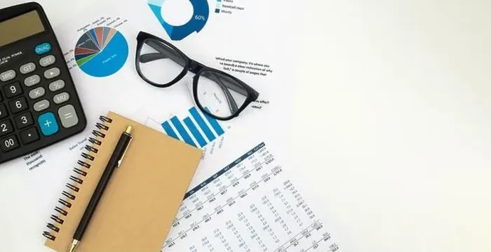 Framed Print : Business accounter working with documents and calculator on white office desk, top view Framed Print : Business accounter working with documents and calculator on white office desk, top view