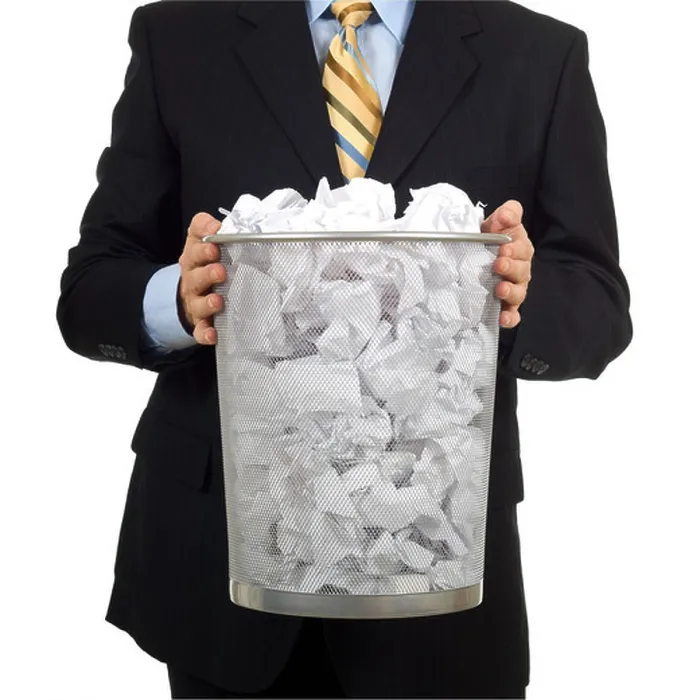 Framed Print : Business man in a business suit carrying out the trash