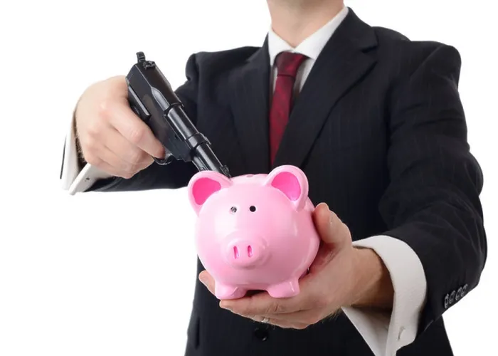 Framed Print : businessman holding bank to ransom with a gun isolated on a white background Framed Print : businessman holding bank to ransom with a gun isolated on a white background