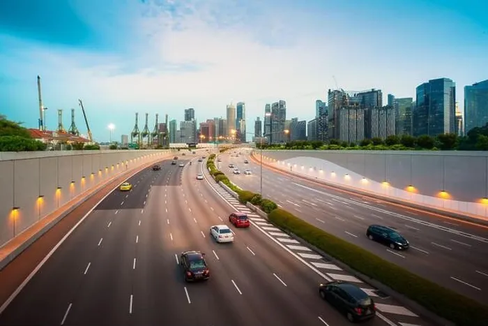 Framed Print : Busy road and city background during rush hour with motion-blurred vehicle, car in Singapore city highway. Singapore tourism, modern city life, or bus
