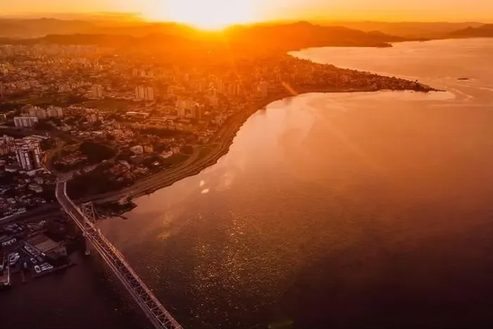 Framed Print : Cable bridge and downtown with sunset light in Florianopolis, Brazil. Drone view Framed Print : Cable bridge and downtown with sunset light in Florianopolis, Brazil. Drone view