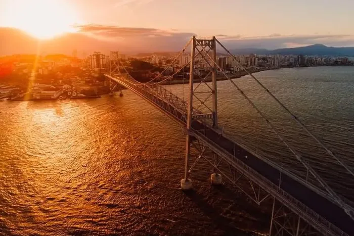 Framed Print : Cable bridge with sunset light in Florianopolis, Brazil. Aerial view Framed Print : Cable bridge with sunset light in Florianopolis, Brazil. Aerial view