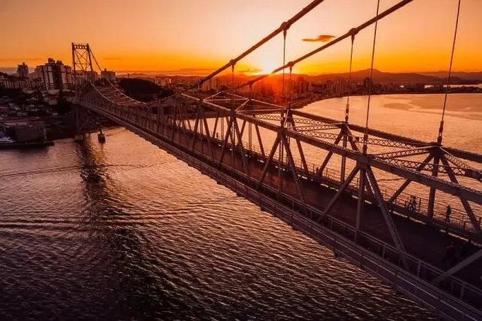 Framed Print : Cable stayed bridge with sunset sky in Florianopolis, Brazil. Aerial drone view Framed Print : Cable stayed bridge with sunset sky in Florianopolis, Brazil. Aerial drone view