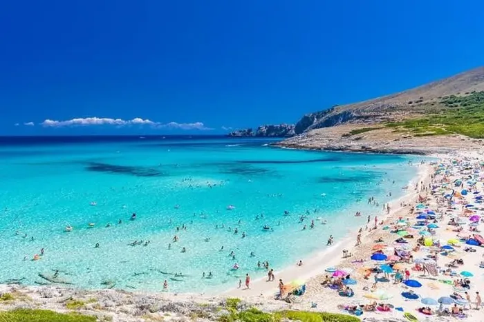 Framed Print : CALA MESQUIDA, MALLORCA, SPAIN - 19 July 2020: People enjoying beautiful sandy beach of on Mallorca Framed Print : CALA MESQUIDA, MALLORCA, SPAIN - 19 July 2020: People enjoying beautiful sandy beach of on Mallorca