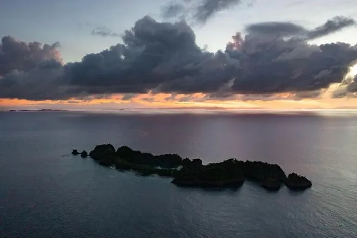 Framed Print : A calm dawn silhouettes beautiful limestone islands in Raja Ampat, Indonesia. This remote, tropical area is known as the heart of the Coral Triangle Framed Print : A calm dawn silhouettes beautiful limestone islands in Raja Ampat, Indonesia. This remote, tropical area is known as the heart of the Coral Triangle