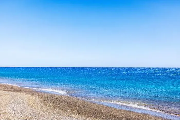 Framed Print : Calm Mediterranean Sea with pebble beach on Crete island, Greece, under clear blue sky Framed Print : Calm Mediterranean Sea with pebble beach on Crete island, Greece, under clear blue sky