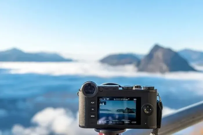 Framed Print : Camera Filming Mountain Peak San Salvatore Above Cloudscape with Sunlight and Clear Sky in Lugano Framed Print : Camera Filming Mountain Peak San Salvatore Above Cloudscape with Sunlight and Clear Sky in Lugano