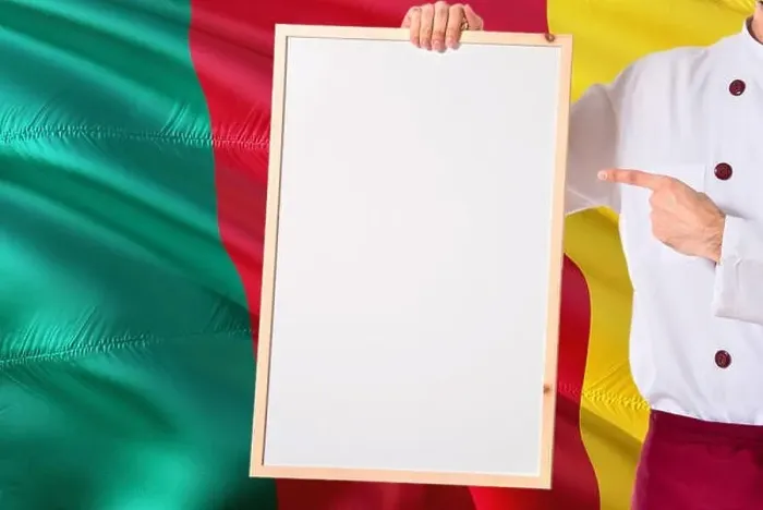 Framed Print : Cameroonian Chef holding blank whiteboard menu on Cameroon flag background Framed Print : Cameroonian Chef holding blank whiteboard menu on Cameroon flag background