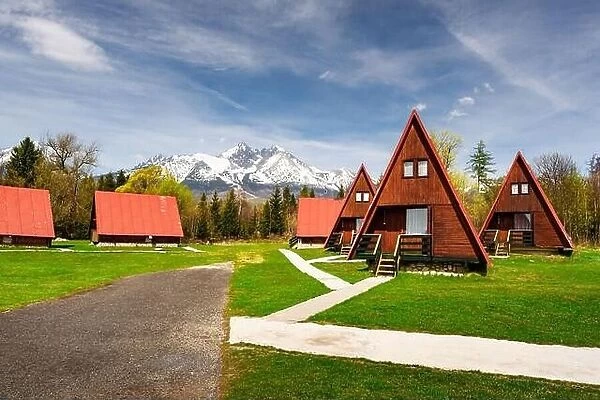 Camping with red wooden houses in Tatra Mountains, High Tatras national park, Slovakia. Landscape photography