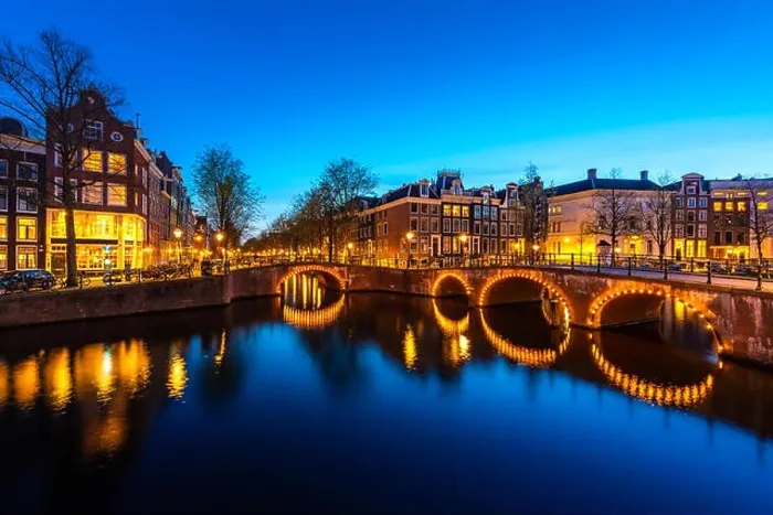 Framed Print : Canals of Amsterdam at night. Amsterdam is the capital and most populous city of the Netherlands Framed Print : Canals of Amsterdam at night. Amsterdam is the capital and most populous city of the Netherlands