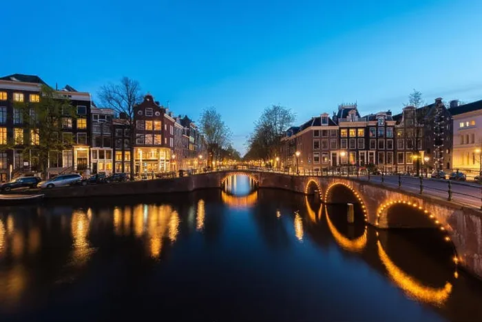 Framed Print : Canals of Amsterdam at night. Amsterdam is the capital and most populous city of the Netherlands Framed Print : Canals of Amsterdam at night. Amsterdam is the capital and most populous city of the Netherlands