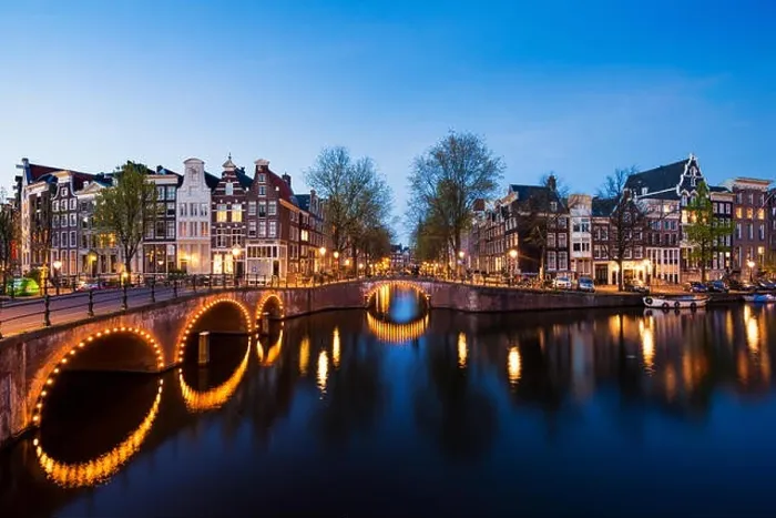 Framed Print : Canals of Amsterdam at night. Amsterdam is the capital and most populous city of the Netherlands Framed Print : Canals of Amsterdam at night. Amsterdam is the capital and most populous city of the Netherlands