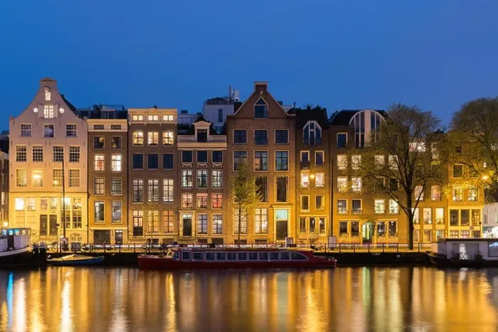 Framed Print : Canals and tradition house in Amsterdam at night. Amsterdam is the capital and most populous city of the Netherlands Framed Print : Canals and tradition house in Amsterdam at night. Amsterdam is the capital and most populous city of the Netherlands