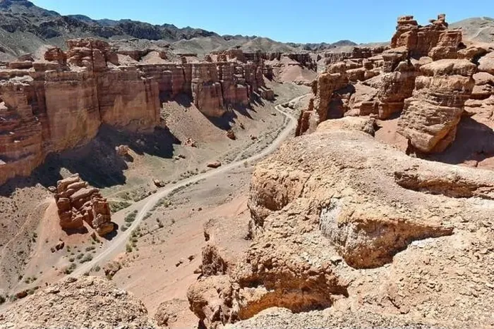 Framed Print : Canyon, panoramic sunlit view with rocks and road Framed Print : Canyon, panoramic sunlit view with rocks and road