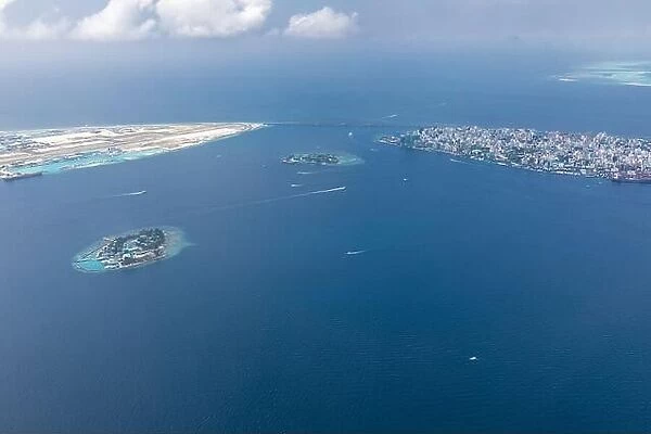The capital of Maldives from the sky. Aerial view on male the capital city of maldives. overcrowded island in the indian ocean blue ocean sea
