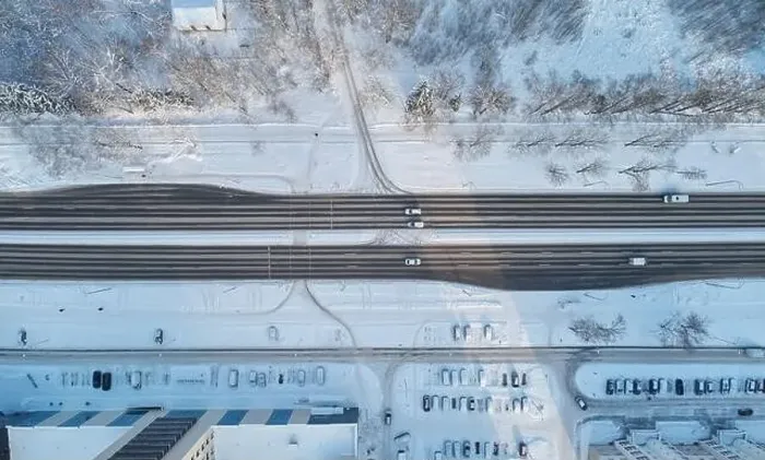 Framed Print : Car move on frozen road aerial above top drone view Framed Print : Car move on frozen road aerial above top drone view