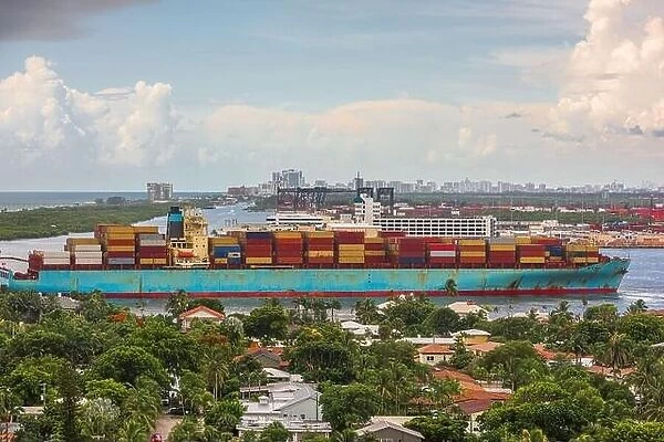 A cargo ship passes through the rivers of Ft. Lauderdale, Florida, USA
